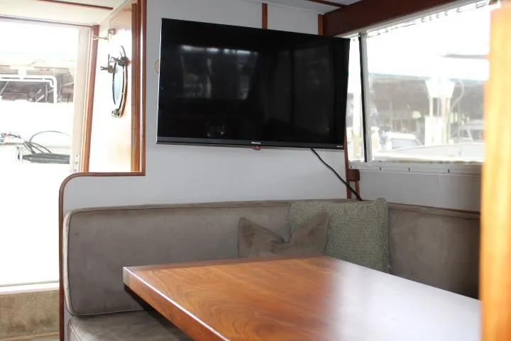 Slide: The Image of Interior of 1988 Tollycraft 30 Sport Cruiser with TV and dining area. - 54