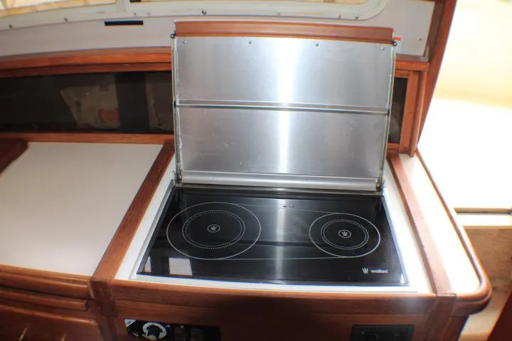 Slide: The Image of 1988 Tollycraft 30 Sport Cruiser kitchen with a two-burner electric stove. - 59