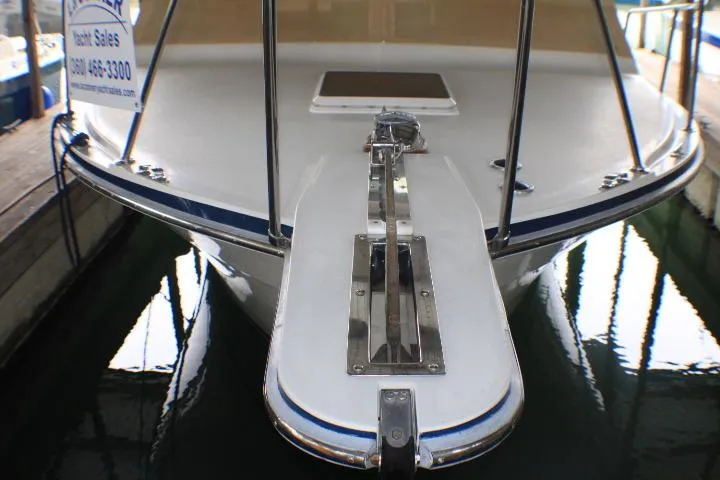 Slide: The Image of 1988 Tollycraft 30 Sport Cruiser bow view in marina setting. - 6