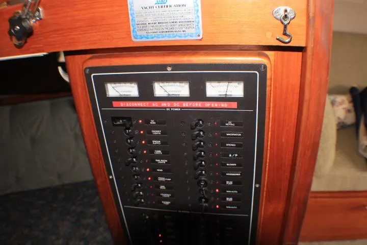 Slide: The Image of Electrical panel of a 1988 Tollycraft 30 Sport Cruiser with gauges and switches. - 68