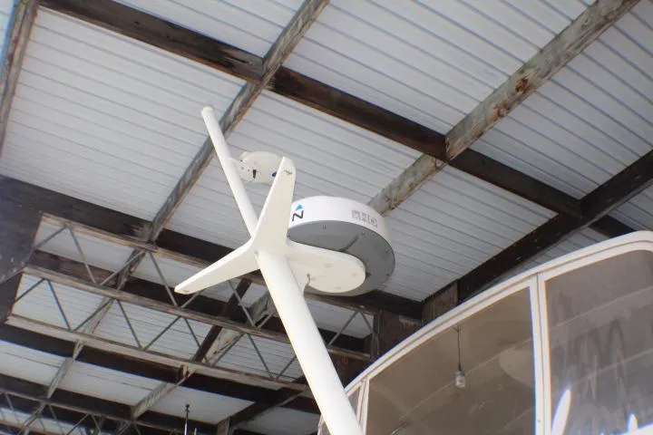 Slide: The Image of Radar equipment on a 1988 Tollycraft 30 Sport Cruiser under a metal roof. - 8