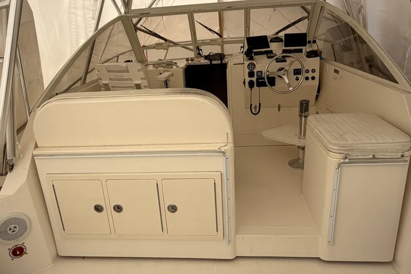 Slide: The Image of 2006 Carolina Classic 28 boat interior with steering wheel and control panel. - 11