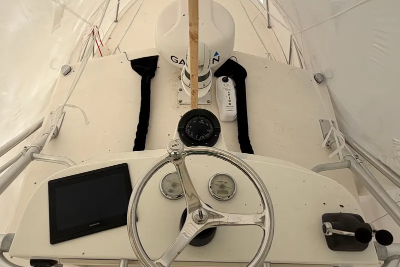 Slide: The Image of Helm of 2006 Carolina Classic 28 boat with Garmin navigation system and compass. - 14