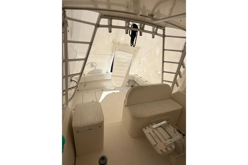 Slide: The Image of Interior view of a 2006 Carolina Classic 28 boat, featuring seating and ladder. - 9