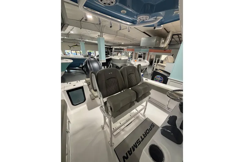 Slide: The Image of 2025 Sportsman Open 232 Center Console boat interior with seating and helm. - 17