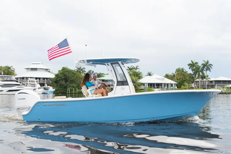 The Image of Manufacturer Provided Image: 2025 Sportsman Open 232 Center Console boat cruising on a calm waterway. - 0