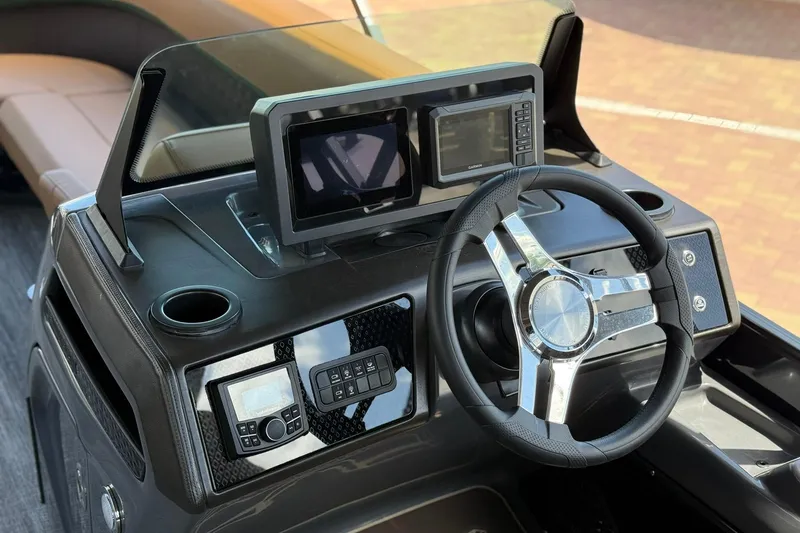 Slide: The Image of Steering console of 2026 Bennington 24 M Quad Bench boat with modern controls. - 11