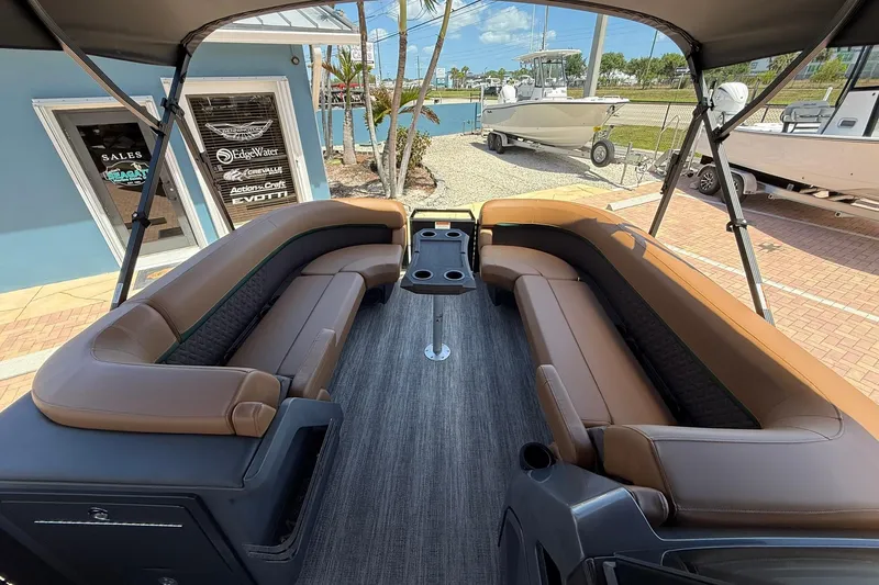 Slide: The Image of 2026 Bennington 24 M Quad Bench pontoon boat with luxurious seating and modern design. - 14