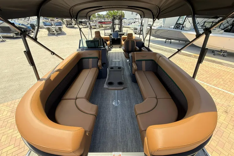 Slide: The Image of Luxurious interior of 2026 Bennington 24 M Quad Bench pontoon boat with plush seating. - 16