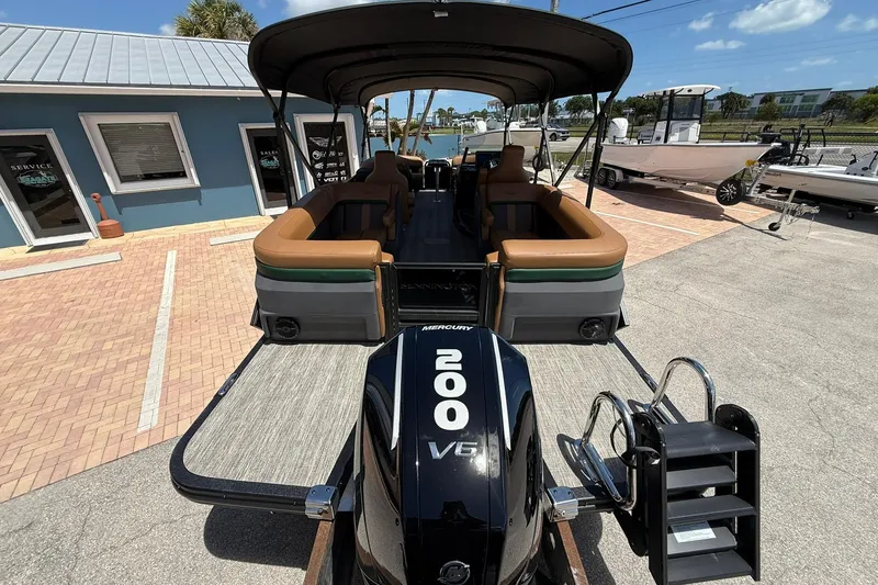 Slide: The Image of 2026 Bennington 24 M Quad Bench pontoon boat with Mercury 200 V6 engine. - 5