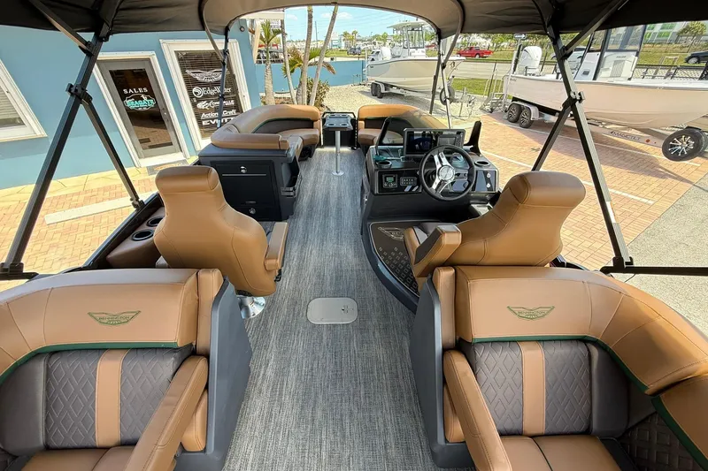 Slide: The Image of Luxurious interior of 2026 Bennington 24 M Quad Bench pontoon boat with plush seating. - 7
