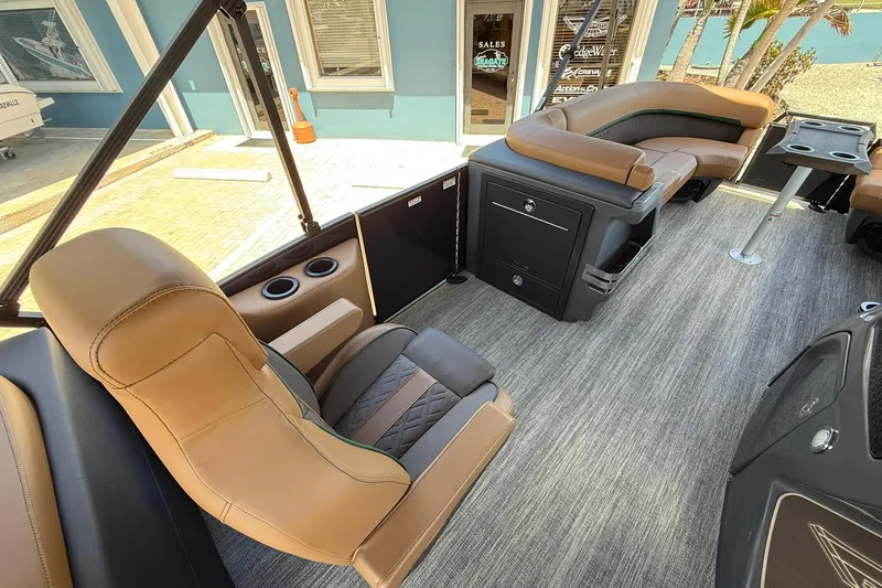 Slide: The Image of Luxurious interior of 2026 Bennington 24 M Quad Bench pontoon boat with plush seating. - 8