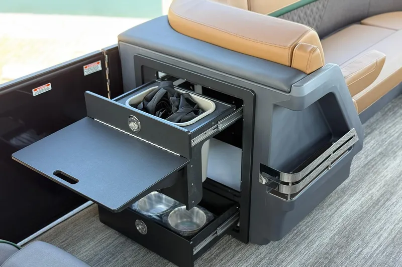 Slide: The Image of 2026 Bennington 24 M Quad Bench with integrated storage and seating features. - 9