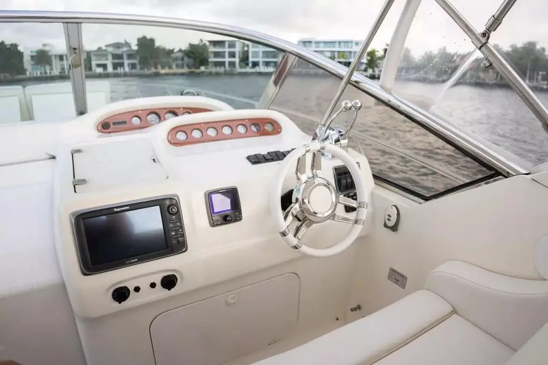 Slide: The Image of 1999 Cranchi Mediterranee 41 yacht helm with modern controls and navigation system. - 12