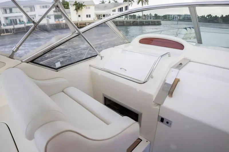 Slide: The Image of Interior of 1999 Cranchi Mediterranee 41 yacht with white seating and control panel. - 13