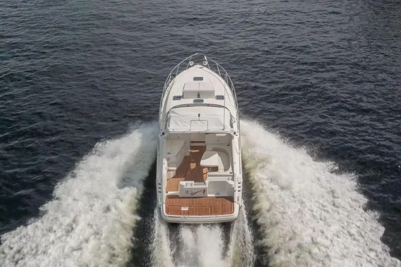 Slide: The Image of 1999 Cranchi Mediterranee 41 yacht cruising on open water, aerial view. - 3
