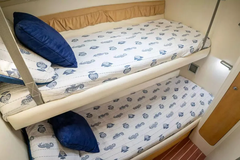 Slide: The Image of Bunk beds in 1999 Cranchi Mediterranee 41 yacht cabin with nautical-themed bedding. - 8