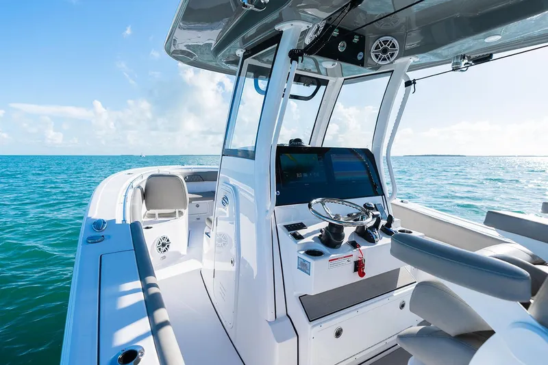 Slide: The Image of Manufacturer Provided Image: 2025 Sportsman Open 282 Center Console boat on clear blue water. - 9