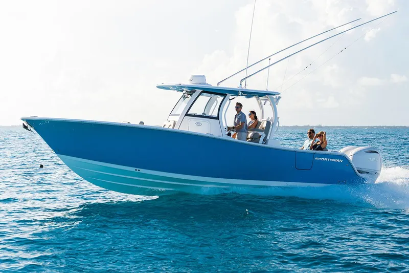 The Image of Manufacturer Provided Image: 2025 Sportsman Open 302 Center Console boat cruising on clear blue water. - 0