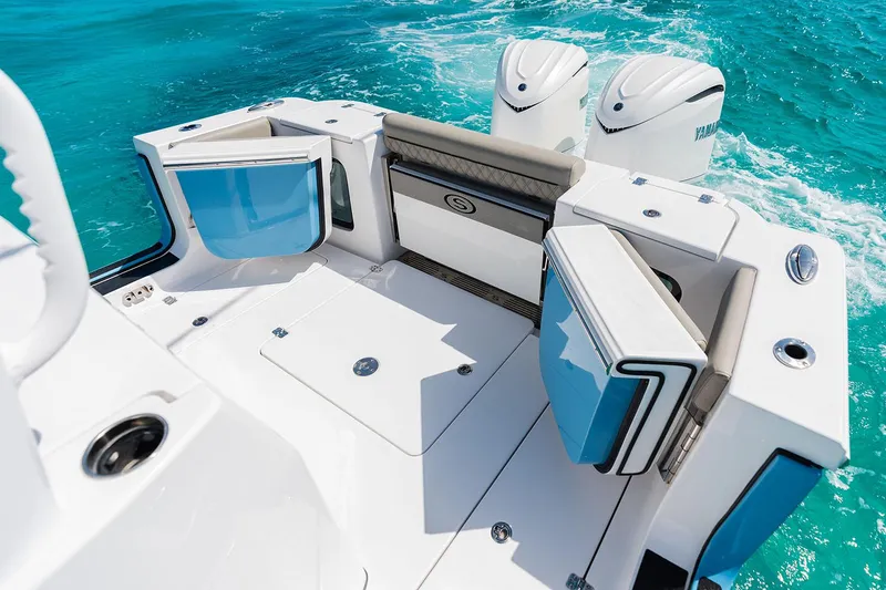 Slide: The Image of Manufacturer Provided Image: 2025 Sportsman Open 302 Center Console boat with dual engines on turquoise water. - 14