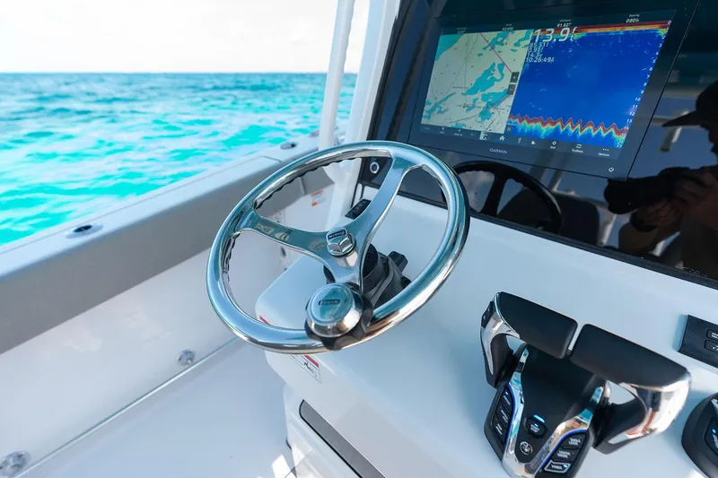 Slide: The Image of Manufacturer Provided Image: 2025 Sportsman Open 302 Center Console with advanced navigation system on open sea. - 6
