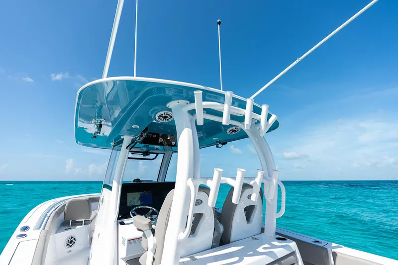 Slide: The Image of Manufacturer Provided Image: 2025 Sportsman Open 302 Center Console boat on clear blue ocean. - 8