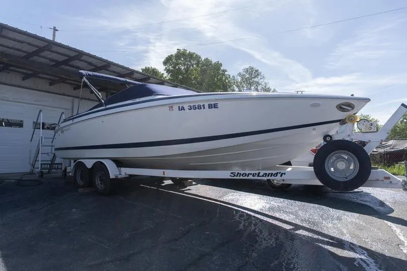 The Image of 2002 Cobalt 262 boat on ShoreLand'r trailer, parked outdoors. - 1