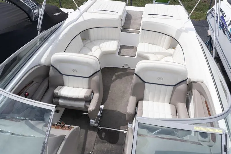 Slide: The Image of Interior of a 2002 Cobalt 262 boat with white leather seating. - 13