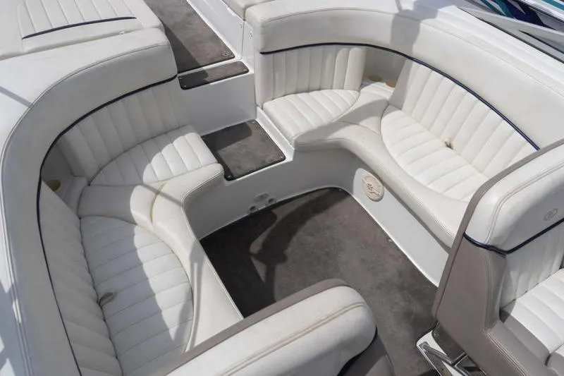 Slide: The Image of Interior seating of a 2002 Cobalt 262 boat with white upholstery. - 16