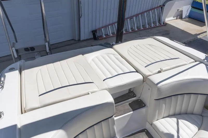 Slide: The Image of Cobalt 262 boat interior, 2002 model, featuring white cushioned seating and sleek design. - 17