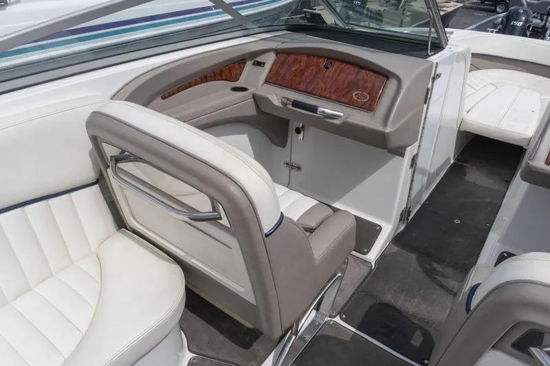 Slide: The Image of Interior of a 2002 Cobalt 262 boat with white and beige seating. - 8