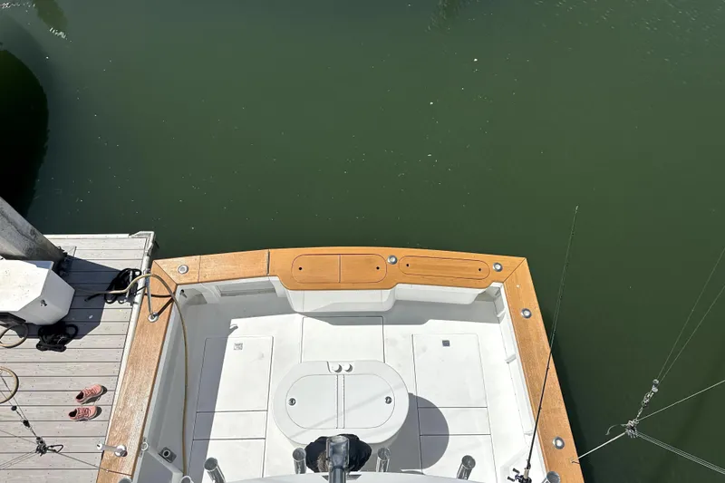 Slide: The Image of Aerial view of a 1997 Cabo 45 Express boat at dock. - 23