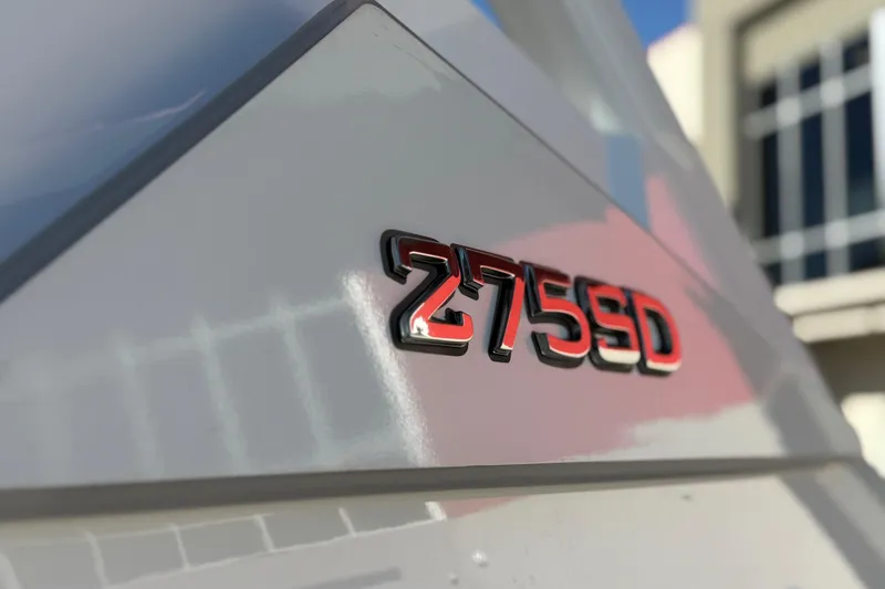 Slide: The Image of 2024 Yamaha Boats 275SD emblem on sleek boat exterior. - 10