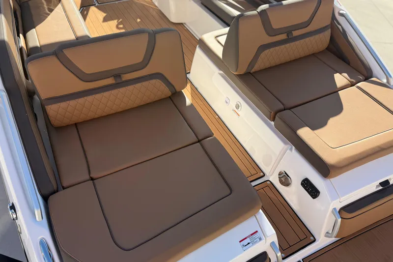Slide: The Image of 2024 Yamaha Boats 275SD interior with luxurious tan seating and teak flooring. - 15