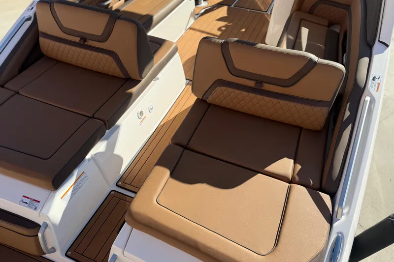 Slide: The Image of 2024 Yamaha Boats 275SD interior with luxurious tan seating and elegant design. - 16