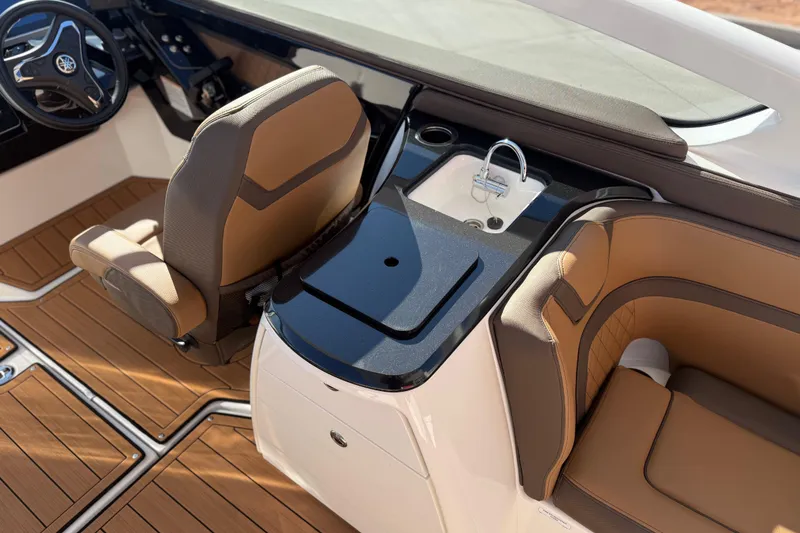 Slide: The Image of 2024 Yamaha Boats 275SD interior with luxurious seating and sleek dashboard design. - 21