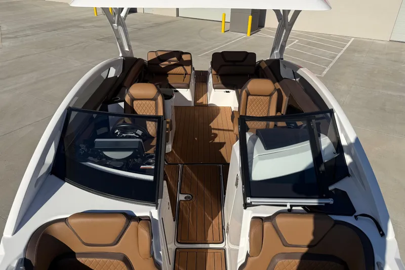 Slide: The Image of 2024 Yamaha Boats 275SD interior with luxurious seating and sleek design. - 32