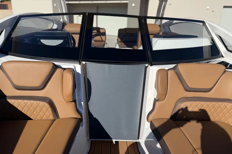 Slide: The Image of 2024 Yamaha Boats 275SD interior with tan leather seats and sleek design. - 34