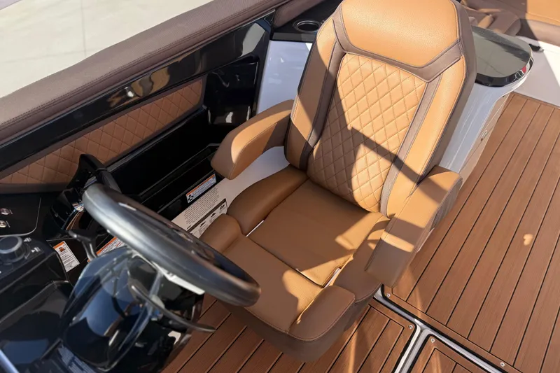 Slide: The Image of Luxurious captain's chair on 2024 Yamaha Boats 275SD, featuring elegant tan upholstery and sleek design. - 35