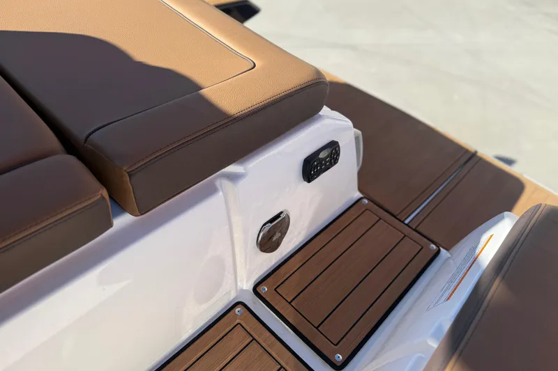 Slide: The Image of 2024 Yamaha Boats 275SD interior with brown seating and teak-style flooring. - 39