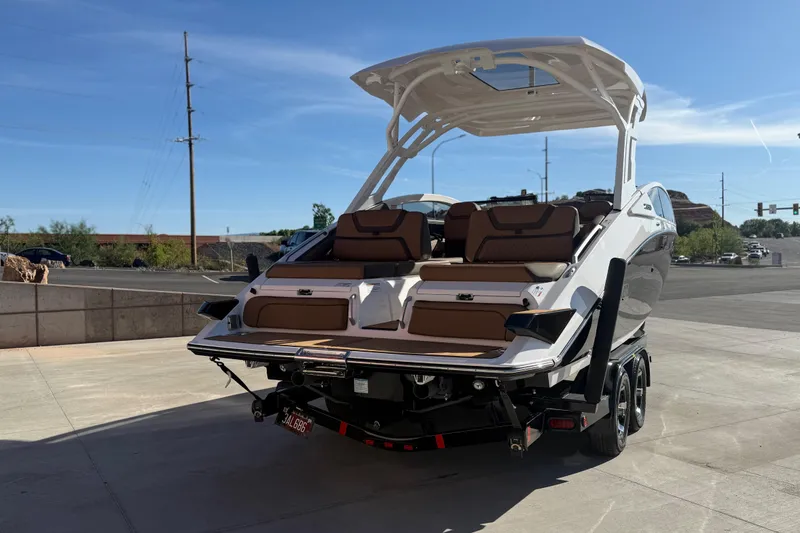 Slide: The Image of 2024 Yamaha Boats 275SD on trailer, showcasing sleek design and spacious seating. - 4
