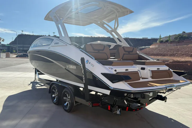 Slide: The Image of 2024 Yamaha Boats 275SD on trailer, sleek design, outdoor setting. - 5