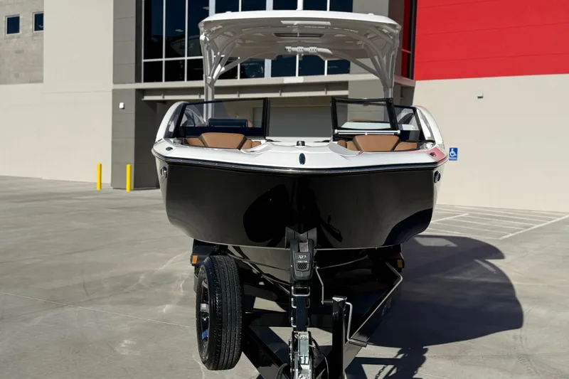 Slide: The Image of 2024 Yamaha Boats 275SD in a parking lot, showcasing sleek design and modern features. - 9