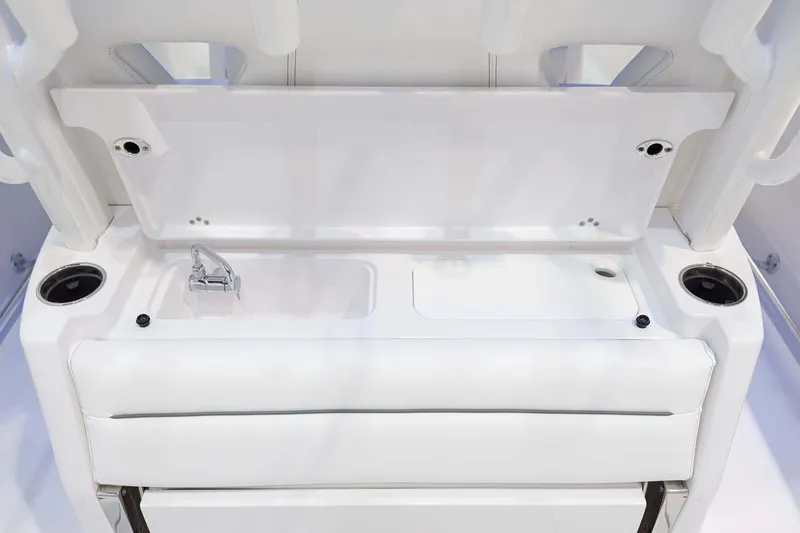 Slide: The Image of Manufacturer Provided Image: 2025 Sportsman Open 322 Center Console boat interior with sink and storage. - 16
