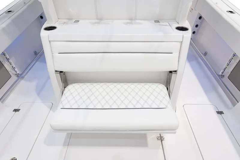 Slide: The Image of Manufacturer Provided Image: 2025 Sportsman Open 322 Center Console boat interior with white cushioned seating. - 17