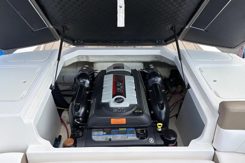 Slide: The Image of 2021 Chaparral 23 SSi boat engine compartment with open hatch. - 27