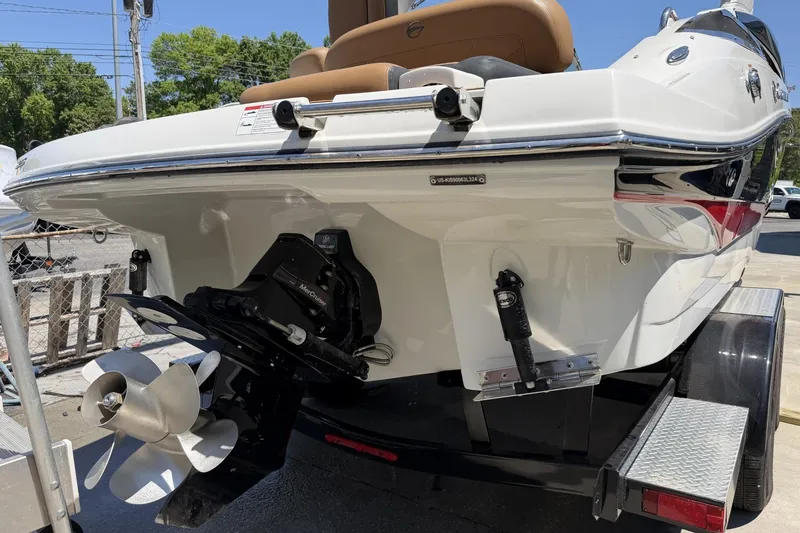 Slide: The Image of 2024 Crownline 260 SS boat rear view with propeller and trailer. - 8
