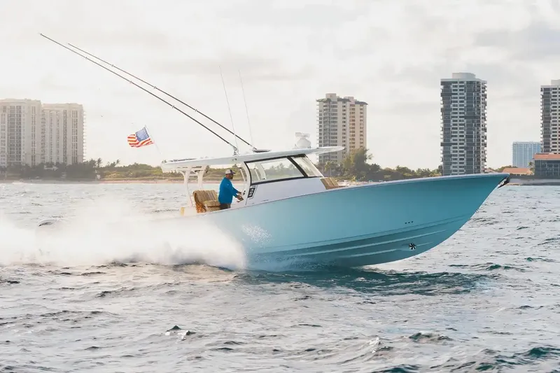 The Image of Manufacturer Provided Image: 2026 Sportsman Open 402 Center Console cruising on water near city skyline. - 0