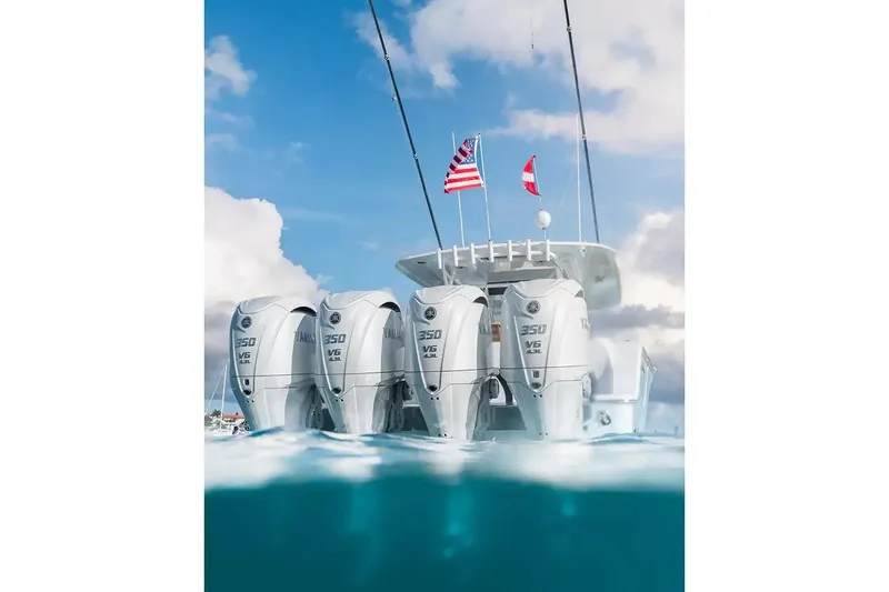 Slide: The Image of Manufacturer Provided Image: 2026 Sportsman Open 402 Center Console with quad Yamaha 350 V6 engines on the water. - 2