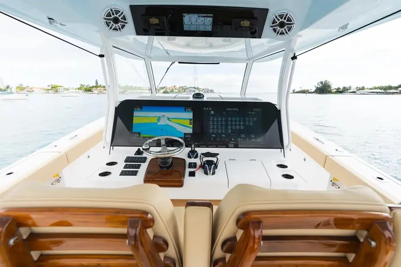 Slide: The Image of Manufacturer Provided Image: 2026 Sportsman Open 402 Center Console boat helm with advanced navigation displays. - 4